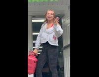 Woman thanking guests after party with helium voice 