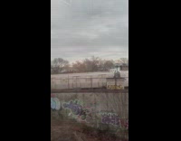 Men Stand Still on Top of Train