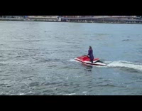 Guy joker costume red jet ski bridge 