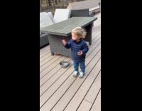 Woman asks toddler what is it his holding