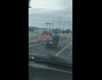 Guy black container attached to scooter freeway 