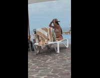 Brown bikini girl white chair pool tripod 