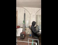 Man waving metal sheet and dances