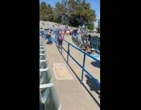 Woman jean skirt poses at the concert