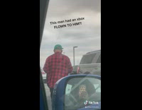 Guy picks up xbox from airport car