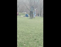Man Dressed in Angel Costume Walks in Between Picnics