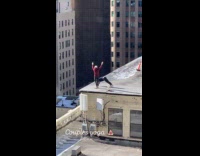 Couples does yoga together at rooftop building