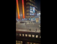 Three people dances middle of the street