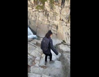 Couple hiking on yosemite falls rocks 
