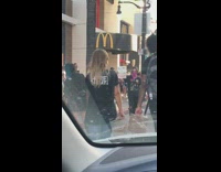 Man protest banner sidewalk McDonalds 
