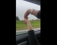 Guy in car condom balloon