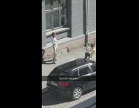 Girl white blouse outside sunny black car