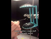 Guy makes small balls levitate with sound