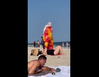 Collab WINY - Man stand up covered with cloth windy beach