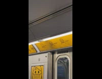 Guy sitting under sign wears face mask incorrectly 