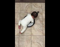 Baby play and ride at the robot toy at home 