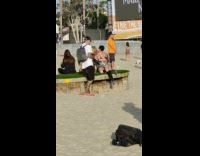 Woman in a shiny dress poses at a music festival