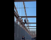 Catwoman and batman sit on bridge steel beams part 2