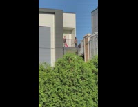 Woman black skirt pink long boots balcony