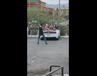 Three girls on convertible car leg split