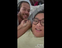Man Armlocks Her Lady While on Bed