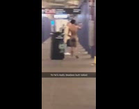 Entirely naked man walks through subway station