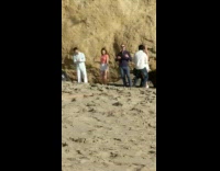 three girls dressed same dance beach