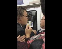 two men glasses pushing each other on subway
