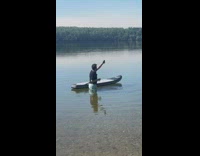 Guy put phone underwater paddle board lake