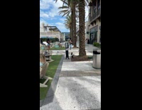 Collab IITW - Man with black beanie and brown vest tiktok dance at the park