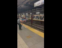 Grown man with nerf gun at subway station