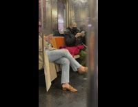 Woman ride subway balance bottle on head