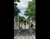 Man riding 3 tire level unicycle