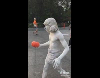 Street performer stone statue pumpkin 