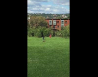 Red sports bra leggings girl dances grass 