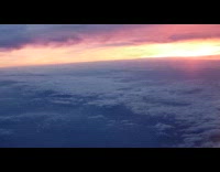 Cloudy sunset sky view from the plane