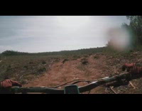 Guy rides bicycle across rocky trail