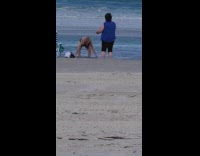 Woman onesie splash water on chest beach
