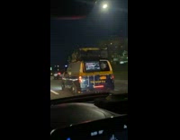 Yellow van has tv facing outwards