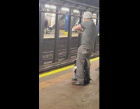 Man plays with crystal glass ball in subway station