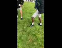 Guys step on water bubble under grass