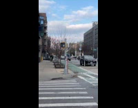 Pedestrian stoplight with stickers look like butt