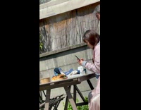 Woman pink dress takes photo of her food