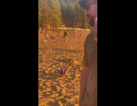 Woman drink poured on head beach sunset