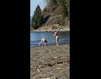 Girl yellow bikini flex back pose seashore