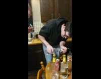 Guy making flaming long island tea 