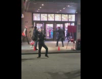 Guy rainbow striped pants and hat dances 