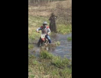 guy in motorcycle driving in swap drops motorcycle 