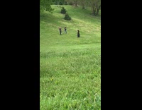 Woman black dress dance video shoot fields