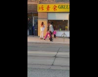 Lady Pretends to Sip on Tumbler while Seated